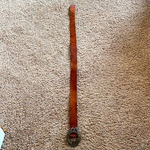 Tan leather belt with silver detailed buckle